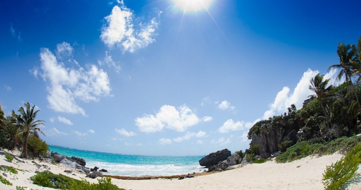 Two headlands framing a single clear channel of open sea, Cancun coastline