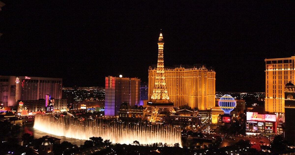 A city skyline lit up at night, every building competing for attention